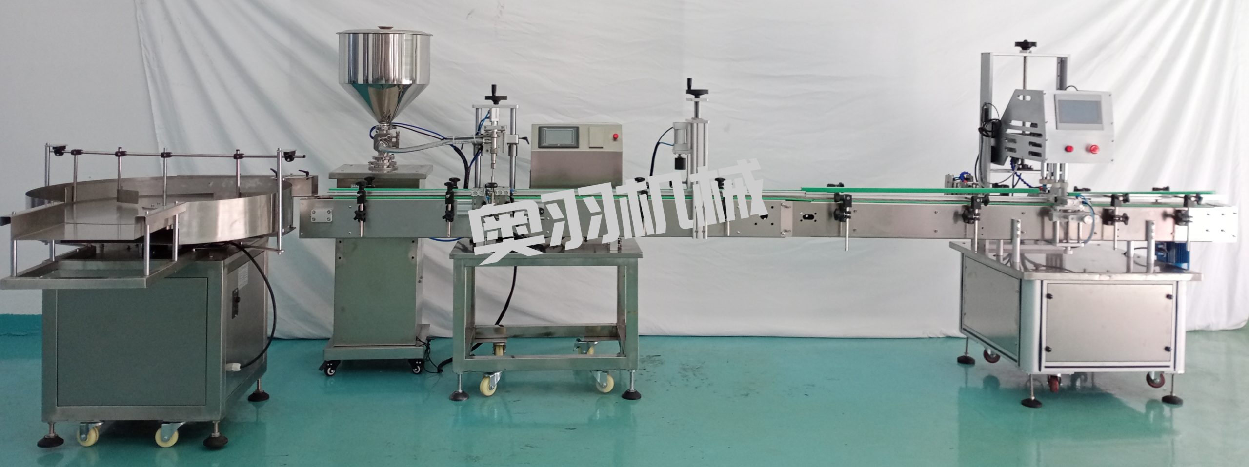 小型液體自動(dòng)灌裝旋蓋流水線(xiàn)_瓶裝灌裝生產(chǎn)線(xiàn)系列_第1張_石家莊奧羽自動(dòng)化設(shè)備有限公司 小型液體自動(dòng)灌裝旋蓋流水線(xiàn)_http://lntfjy.com_瓶裝灌裝生產(chǎn)線(xiàn)系列_第1張